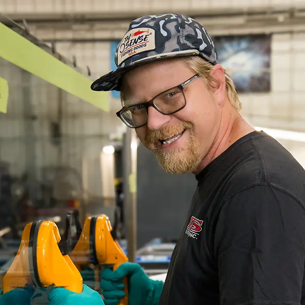 DTS Employee Nate moving glass component